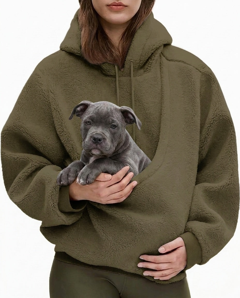 Army green JOEY pouch hoodie worn with a grey Bully puppy sitting in the front pouch