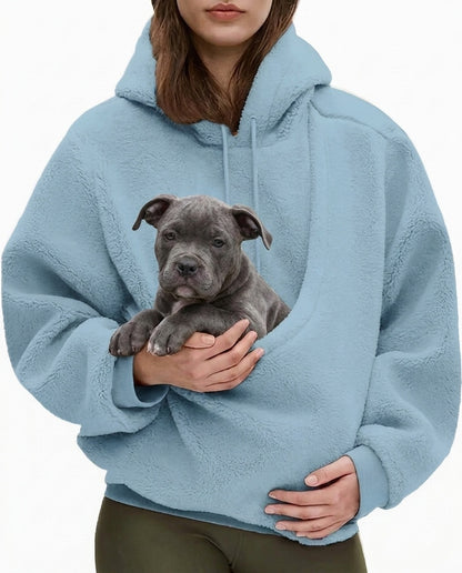 Sky blue JOEY pouch hoodie worn with a grey Bully puppy sitting in the front pouch