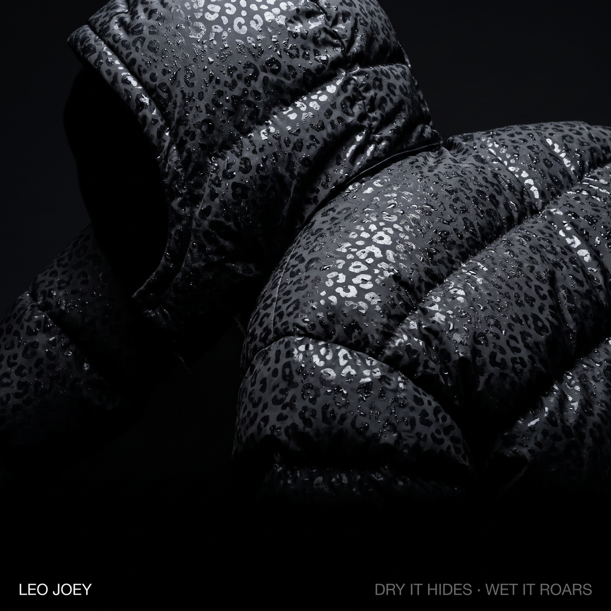 Leopard reveal puffer campaign shot in black