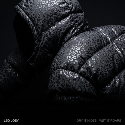Leopard reveal puffer campaign shot in black