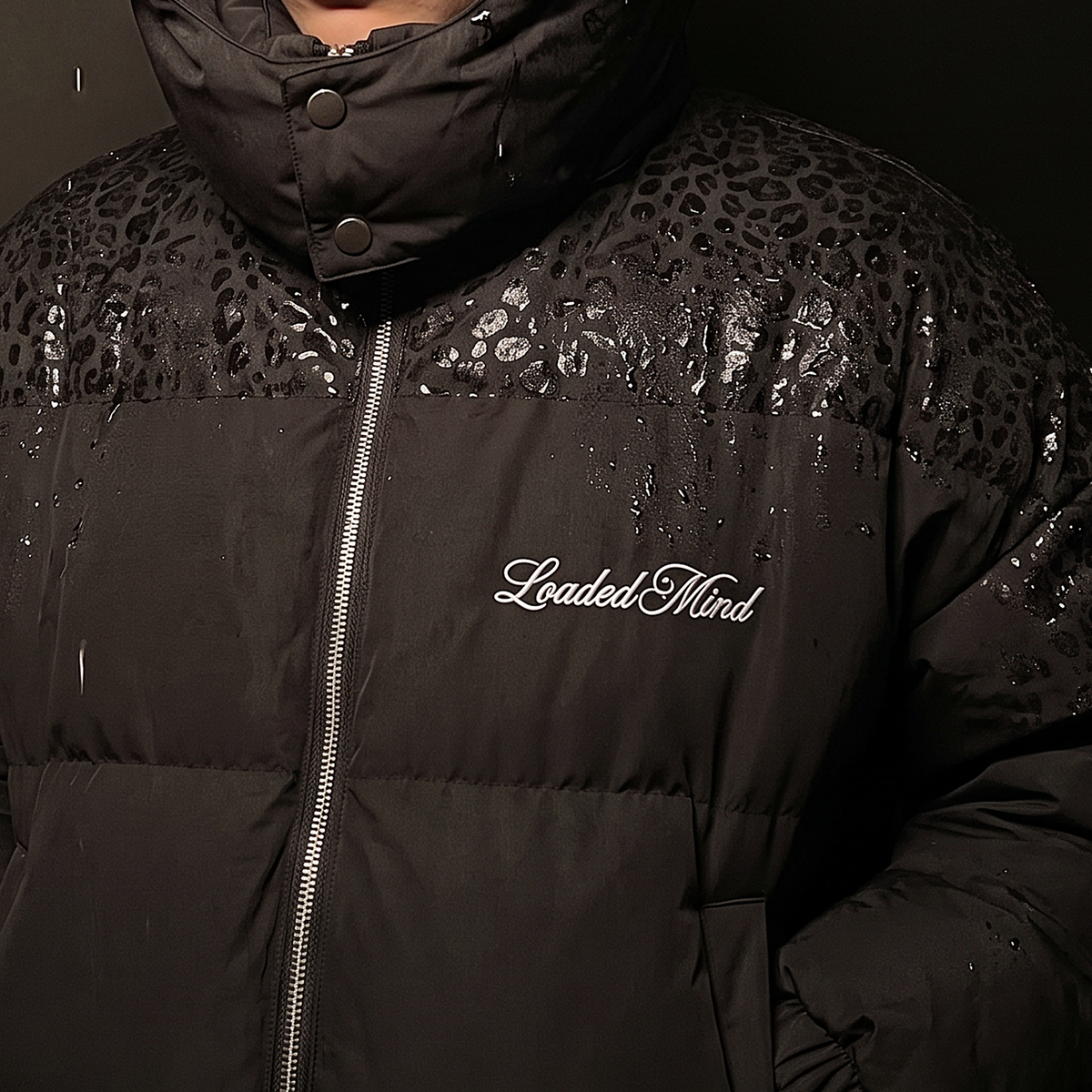Loaded Mind embroidered on the chest of the leopard reveal puffer