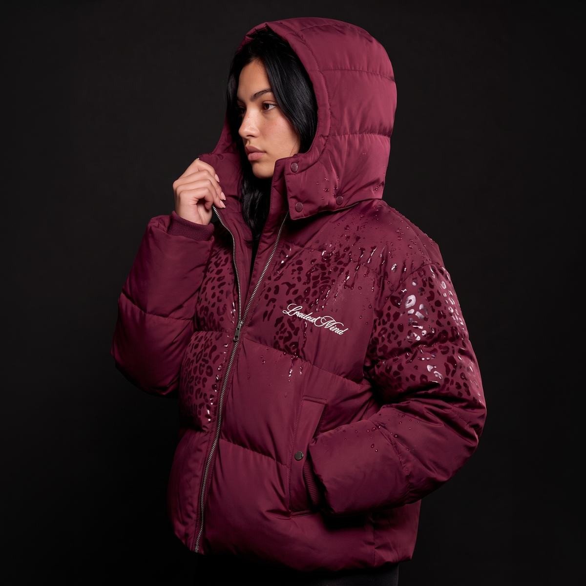 Burgundy leopard reveal puffer seen from the side, pattern showing where wet