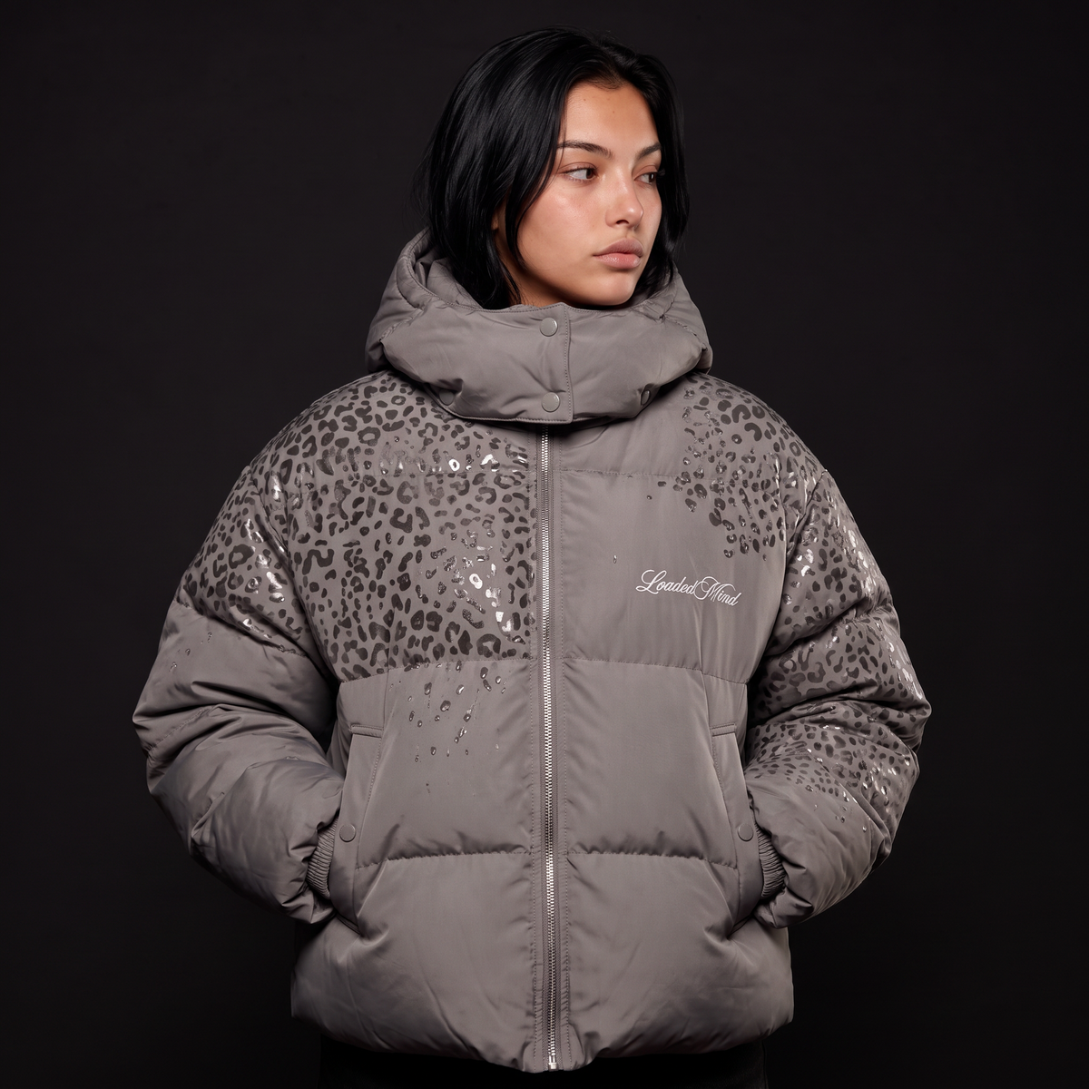 Grey leopard reveal puffer worn front on, pattern showing where wet