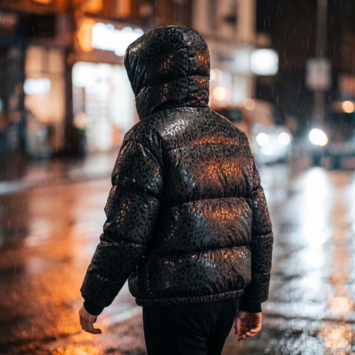 Black leopard reveal puffer on a wet street at night, seen from behind